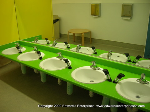 A nice sink and faucet combination in an elementary school