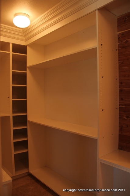 A master bedroom closet in a home residence, created for easy family access: Edward’s Enterprises Closet Organizer.
