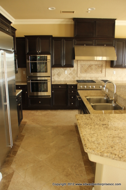 Kitchen renewed with new tile, counter repair, new appliances, painting, and more!