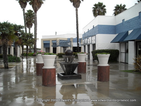 Shot of fountain and planters after Edward's Enterprises commercial remodeling project: Commercial Sign that was demolished to allow for a new fountain and planter area.