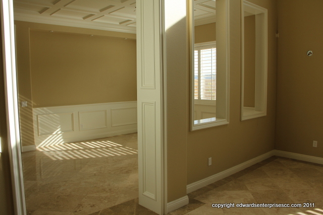 A dining room patched, textured and painted in a medium texture spray pattern.