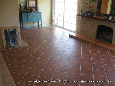 Residential Flooring Project: red floor tile set at a diagonal in a customer's home.