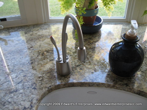 Installation of a water filtration unit and spout, something we have completed for many of our apartment tenant customers.