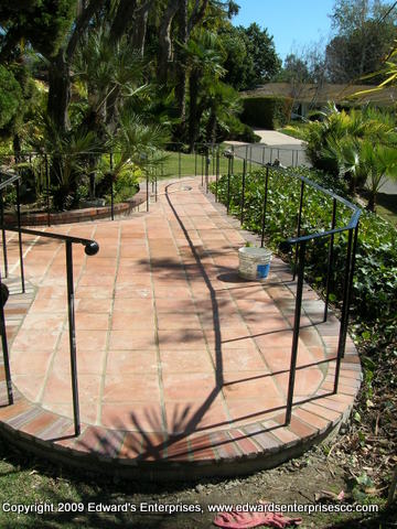 Residential Remodeling Project: Brick walkway and Wrought Iron railing repaired for residential remodeling project by Edward's Enterprises which included extensive exterior and interior work.
