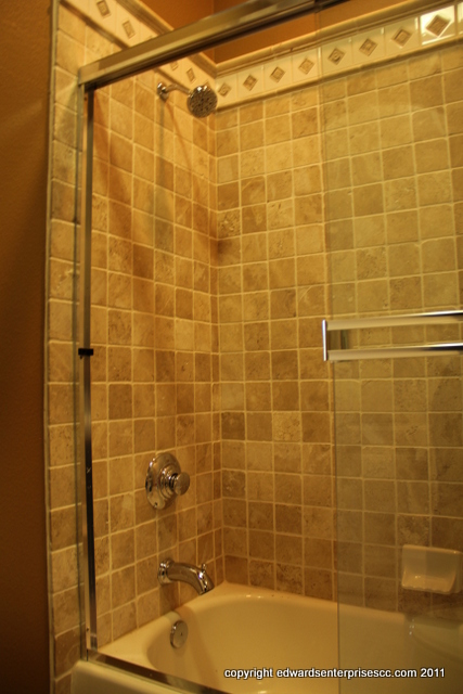 Bathroom Remodels and Remodeling: A smooth-running shower faucet in a bathroom shower and tub combination.