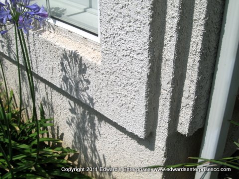 House exterior blue stucco remodel touch-up.