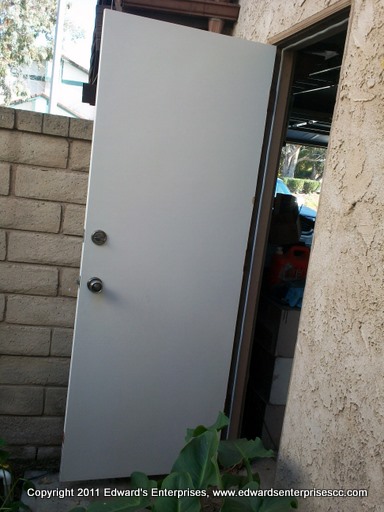 A side door primed and installed to satisfaction; get yours today from Edward's Enterprises!