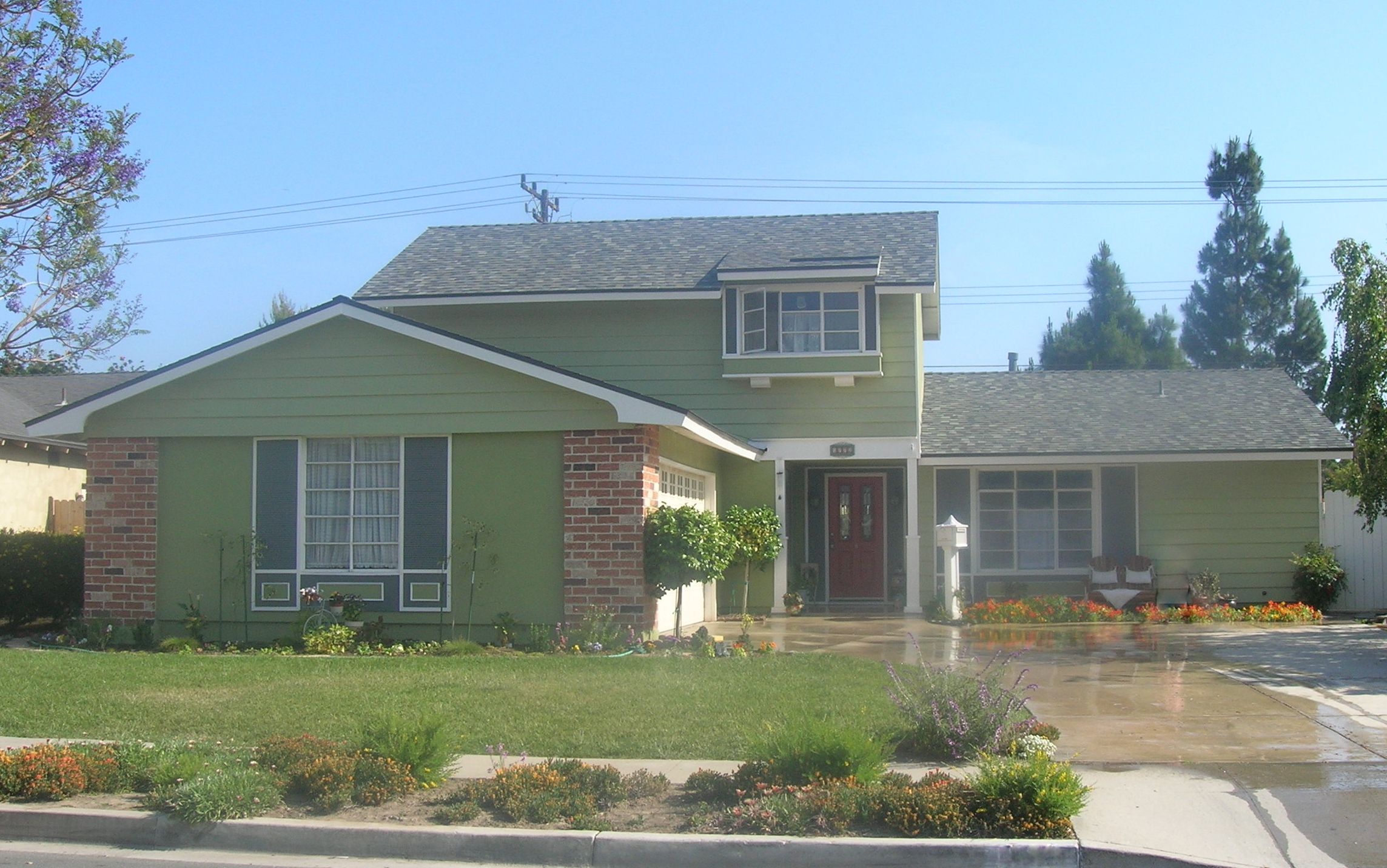 Residential Remodel Inside & Out After, Including: Paint Inside and Out, Roof, Front Facade, Laminate Flooring, Electrical, Tile Flooring, Landscaping, Doors Inside & Out, Drywall, Ceilings Scraped, Plumbing, and More.