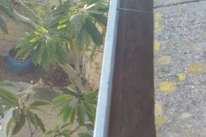 Landscaping Rain Gutter Debris Cleaning - Landscaping