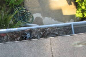 Landscaping Rain Gutter Leaves Debris Cleaning - Landscaping