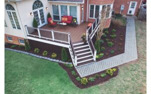 Freshly painted deck with new landscaping surrounding it
