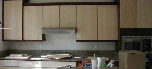 Kitchen with granite counter tops in the process of being remodeled.