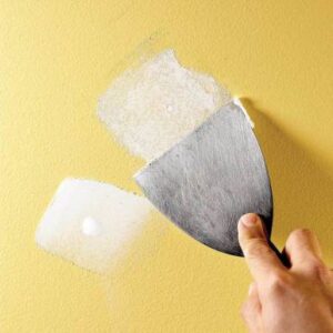 Drywall repair, application of spackle to small holes