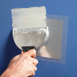 Application of spackle and mesh to repair drywall