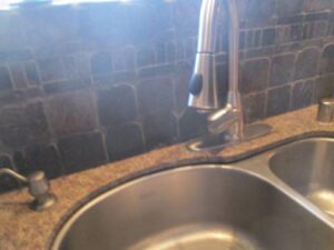 Clean, new faucet after photo