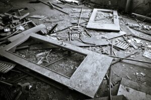 Broken door in ruins on floor