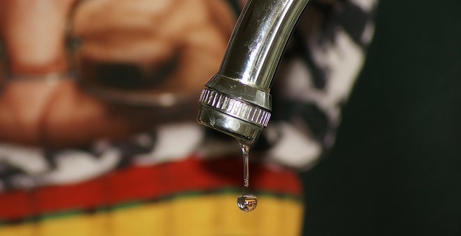 Water dripping out of faucet.