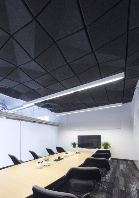 Artsy black acoustic ceiling tile in a conference room