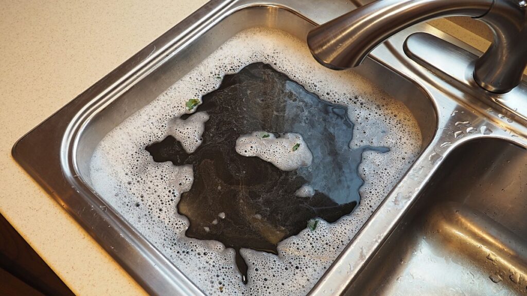 An image of a clogged kitchen sink.