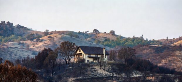 A home in a burned hillside area